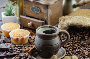 Coffee in a cup and saucer on an old background.