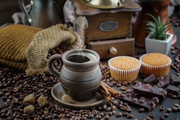 Coffee in a cup and saucer on an old background.