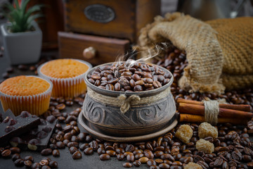 Coffee grains on a table with accessories for coffee