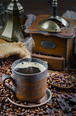 Black coffee on an old background in a cup