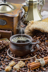 Coffee in a cup and saucer on an old background.