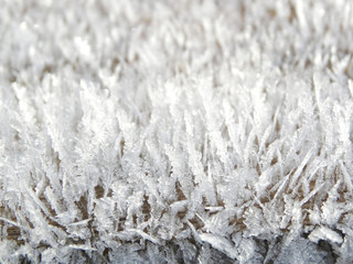 winter background with snowflakes crystals patterns and snow on frozen grass