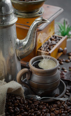 Black coffee on an old background in a cup
