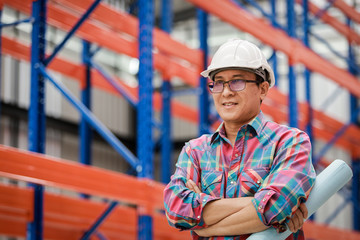 Asian Engineer man working in building factory