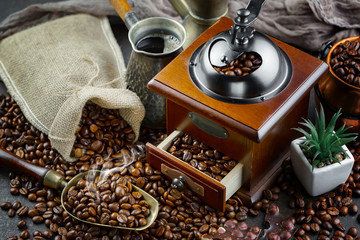 Coffee in a cup on a background of coffee beans, on an old background.