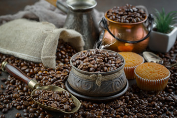 Coffee in a cup and saucer on an old background.