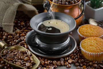 Black coffee on an old background in a cup