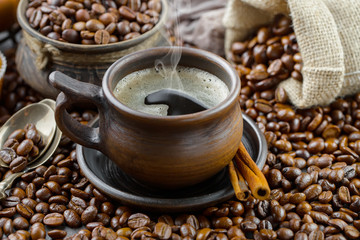 Coffee in a cup and saucer on an old background.