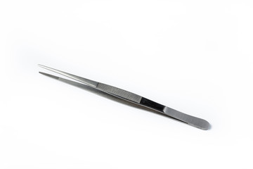 Stainless steel tweezers on white background