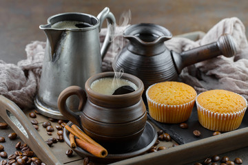 Black coffee on an old background in a cup