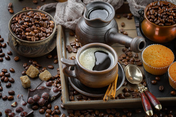 Black coffee on an old background in a cup
