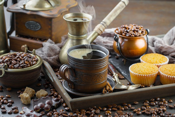 Black coffee on an old background in a cup