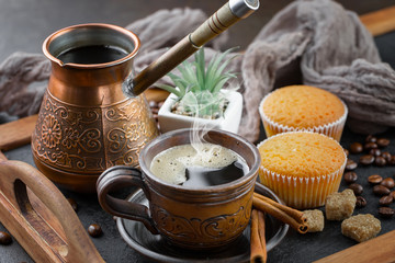 Black coffee on an old background in a cup