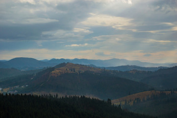 Autumn landscape background in the rain weather with fog