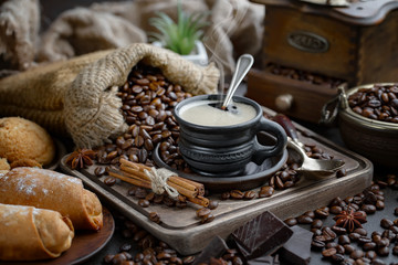 Black coffee on an old background in a cup