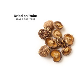 Overhead image of dried shiitake mushrooms isolated on white background with copy space