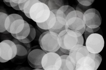 Blurry black and white  bokeh glowing in the dark