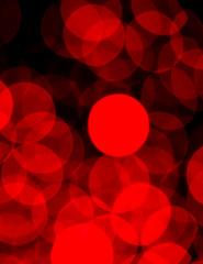 Blurry red light bokeh glowing in the dark