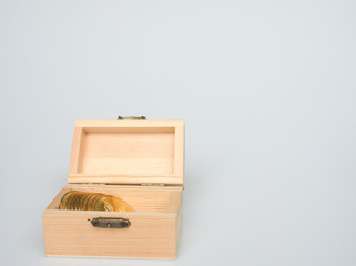 The row of Bitcoin Crypto currency is stored in the open wooden box.