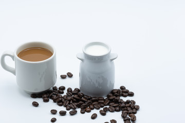 Milk coffee in a ceramic cup on a white background