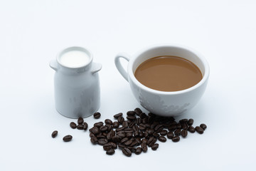 Milk coffee in a ceramic cup on a white background
