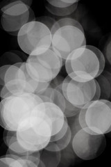 Blurry black and white  bokeh glowing in the dark