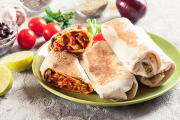 Burritos wraps with mincemeat, beans and vegetables