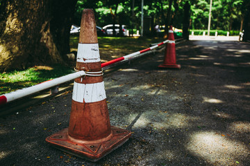 Traffic cones or Parking cones in the public park. in dark tone.