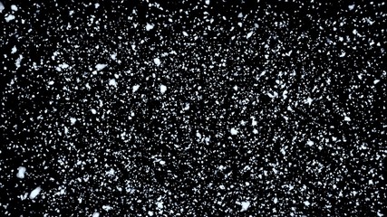 Snow flakes falling on black background. Winter weather