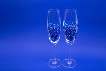 Two champagne glasses.
