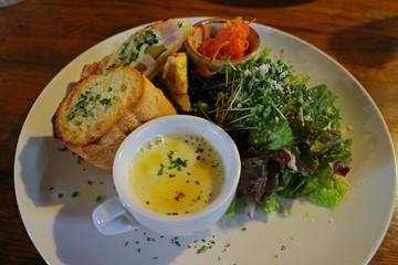 Lunch plate with corn soup and quiche in Italian restaurant in Osaka, Japan