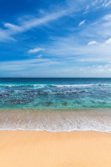 Fototapeta na wymiar Beautiful tropical sandy beach and turquoise sea. Summer vacation and tropical beach concept. 