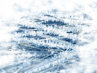 winter background with snowflakes crystals patterns and snow on frozen grass