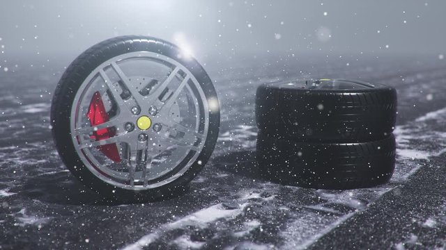 Winter tires on a background of snowstorm, snowfall and slippery winter road. Winter tires concept. Wheel replacement. Road safety concept. 4k 3d animation with falling snow
