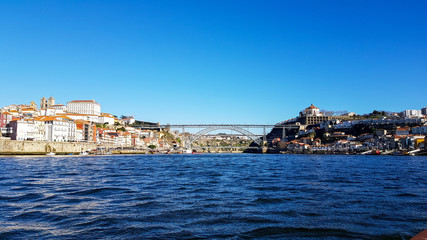 Fototapeta na wymiar Porto Bridge with blue sky and the river