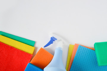 Cleaning set for different surfaces in kitchen, bathroom and other rooms. spray bottle with Shape Sponge and kitchen rags. flat lay, top view. Cleaning service concept. Early spring regular clean up.