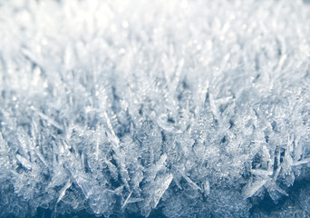 winter background with snowflakes crystals patterns and snow on frozen grass