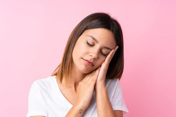 Young woman over isolated pink background