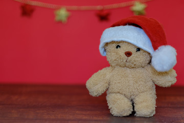 Bear doll wear Christmas hat.