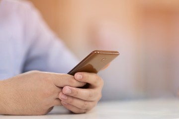 A man searching some data from his smartphone