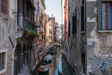 Fototapeta na wymiar Panoramic view of Venice narrow canal with historical buildings and boat