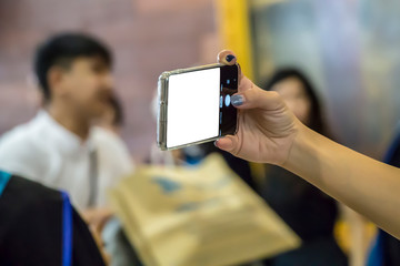 Woman using smart phone take a photo (selfie),isolated on white background