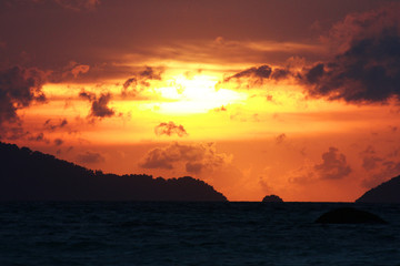 Beautiful seascape and tropical island with sky in twilight of sunset over the mountain in sea at Thailand