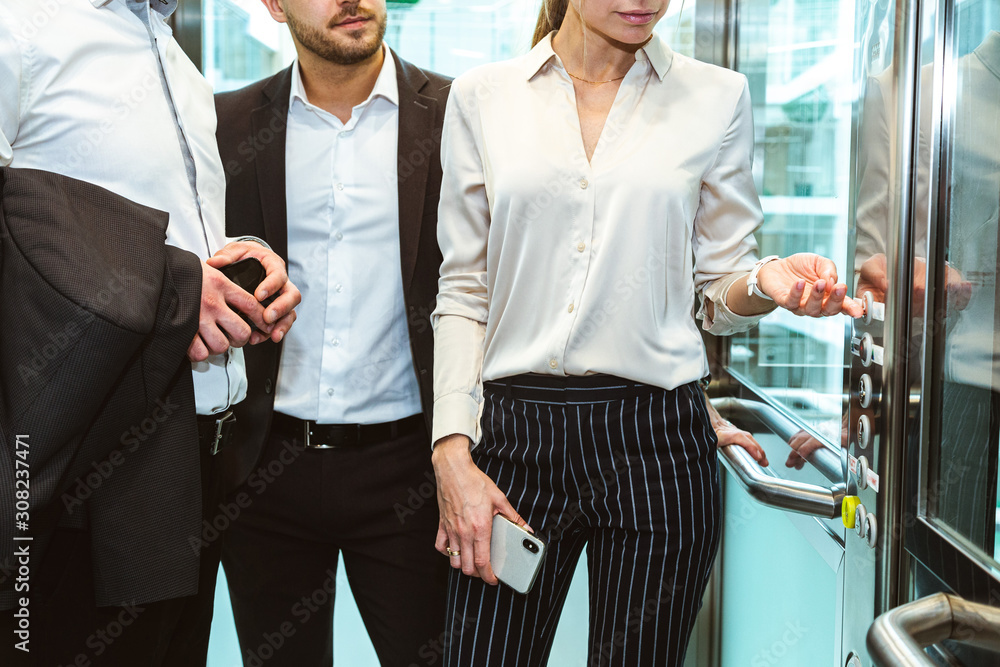 Sticker Business team group going on elevator. Business people in a large glass elevator in a modern office. Corporate businessteam and manager in a meeting.