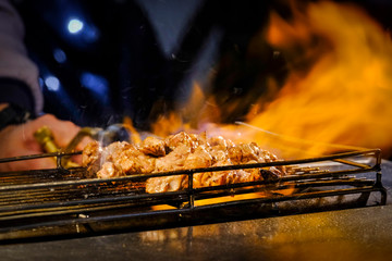 grilled pork on grill at street food Taipei /