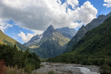 Obraz premium Panorama view on mountains with river scene in national park of Dombay