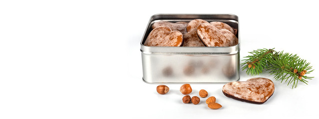 gingerbread nuts in metal box on white background