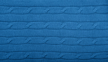 Background of blue knitted wool fabric texture
