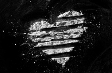 White powder in shape heart, cocaine line isolated on black background, top view, series - obrazy, fototapety, plakaty
