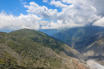Naklejka premium Panorama of mountains scene, walk through the great Aletsch Glacier
